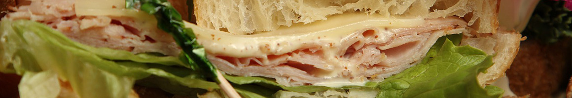 Eating Deli Italian Sandwich at Desiato's Deli & Subs restaurant in Rochester, NY.